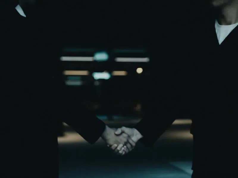 Event partners shaking hands after confirming staffing details