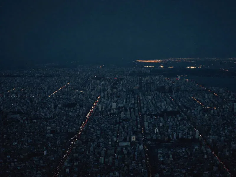 Aerial city skyline at night representing local staffing markets